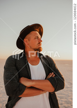 portrait of young tanned blonde European courageous man with beard barefoot 120084812