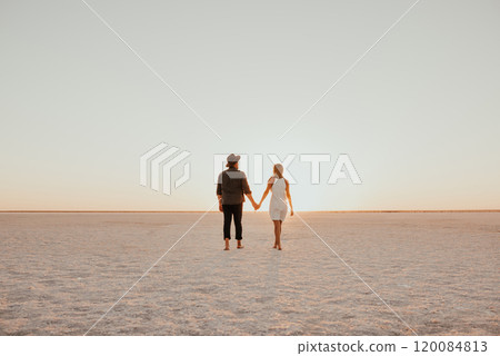 pink Lemurian lake, romantic photoshoot of young couple in love pink Lemurian lake, romantic photoshoot of young couple in love 120084813