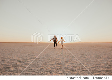 pink Lemurian lake, romantic photoshoot of young couple in love pink Lemurian lake, romantic photoshoot of young couple in love 120084815