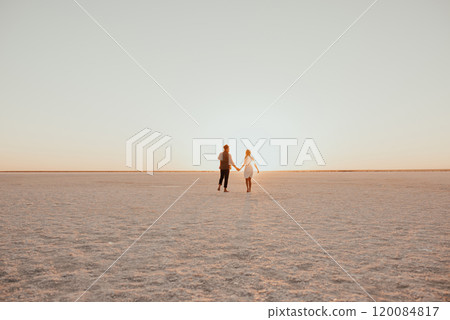 pink Lemurian lake, romantic photoshoot of young couple in love pink Lemurian lake, romantic photoshoot of young couple in love 120084817