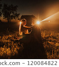 couple of young people background of car with headlights on 120084822