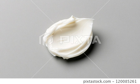 White cream dollop on grey background close-up 120085261