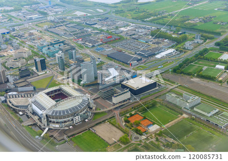 An aerial view city Amsterdam in cloudy weather of rooftops over neighborhood city 120085731