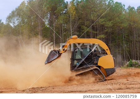Bulldozer is leveling ground earthmoving on construction site preparing grading soil, for construction 120085759