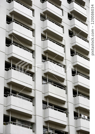 The exterior of a 1970s apartment building with evenly spaced balconies The exterior of a 1970s apartment building with evenly spaced balconies 120086034