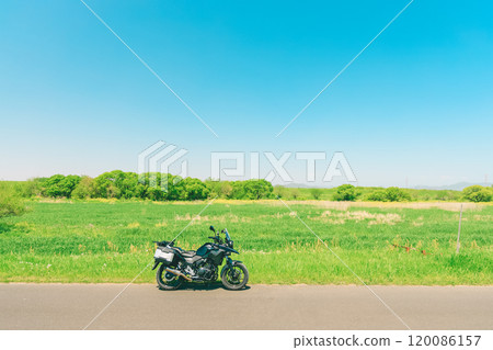 Summer blue sky, wide grassland and bike Summer blue sky, wide grassland and bike 120086157