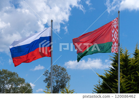 Flags of Russia and Belarus fluttering in the wind. 120086462