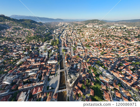 Aerial drone view of city of Sarajevo. Capital of Bosnia and Herzegovina, Balkan. Bridges over Miljacka River in Center. Aerial drone view of city of Sarajevo. Capital of Bosnia and Herzegovina, Balkan. Bridges over Miljacka River in Center. 120086971