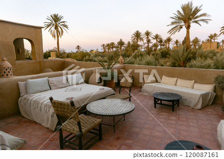 General view of the terrace of a rihab at sunrise in the Sahara, Merzouga. 120087161