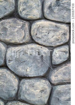 Textured stone wall featuring gray and beige tones in a rustic style 120087438