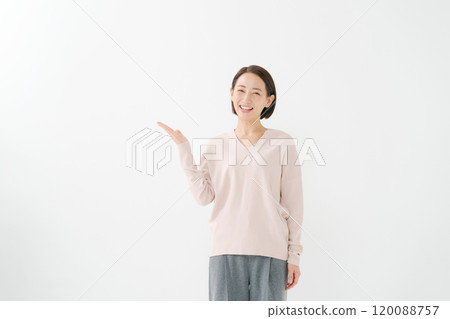 Middle aged woman pointing Middle aged woman pointing 120088757