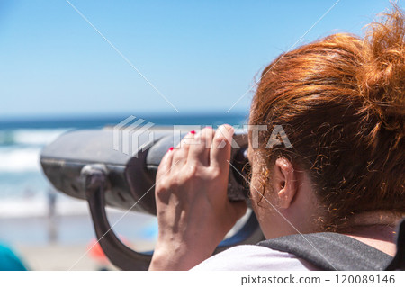 Woman tourist looking into the distance through 120089146