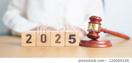 Happy New Year 2025 with judge gavel on table. Law, lawyer, judgment, justice auction and bidding concept 120089188