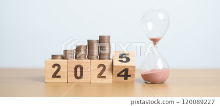 2024 end year to Happy New Year 2025 with hourglass and coins stack arrangement. Money Saving for Future Plan, Retirement fund, Pension, Investment, Wealth Business, Financial and countdown concepts 120089227