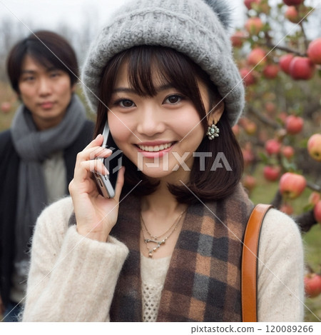 Stock photo (high quality, paid) A woman making a phone call on her smartphone 120089266