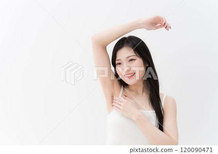 Hair removal/beauty: Young woman concerned about her armpits, upper body 120090471