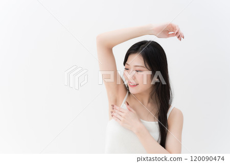 Hair removal/beauty: Young woman concerned about her armpits, upper body Hair removal/beauty: Young woman concerned about her armpits, upper body 120090474