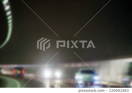 Image of headlight reflection of oncoming vehicle in tunnel (blurred) Image of headlight reflection of oncoming vehicle in tunnel (blurred) 120091863