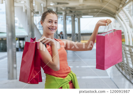 Shopaholic Women holding shopping bags ,money ,credit card person at shopping malls.Fashionable Woman love online website with sales tag on black Friday. E-commerce fashion digital marketing lifestyle Shopaholic Women holding shopping bags ,money ,credit card person at shopping malls.Fashionable Woman love online website with sales tag on black Friday. E-commerce fashion digital marketing lifestyle 120091987