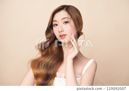 Beautiful young asian woman with clean fresh skin on beige background, Face care, Facial treatment, Cosmetology, beauty and spa, Asian women portrait. 120092087