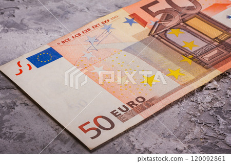 A Detailed CloseUp Image of a 50 Euro Banknote Resting on a Textured Surface with Interesting Features A Detailed CloseUp Image of a 50 Euro Banknote Resting on a Textured Surface with Interesting Features 120092861
