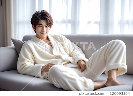 A handsome man relaxing on a sofa in a living room with the morning sun shining in. Loungewear. Fluffy pajamas. AI generated 120093364