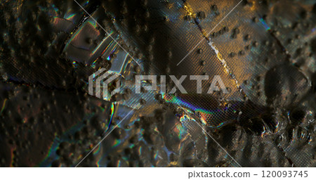 Fantastic surface. Wet highlights. Fabric texture with iridescent light. Rough silver background with sparkle spots changing color rainbow effect. 120093745