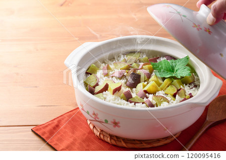 Sweet potato rice cooked in a clay pot Sweet potato rice cooked in a clay pot 120095416