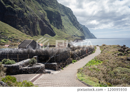 Picturesque deserted old town located on the coast under big green cliffs, Madeira, Portugal 120095930