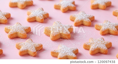 Star shaped gingerbread cookies on pastel pink background for holiday baking inspiration 120097438