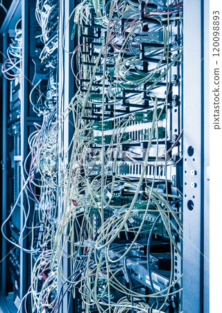 Server rack with fiber optic cables attached to front panel swit 120098893
