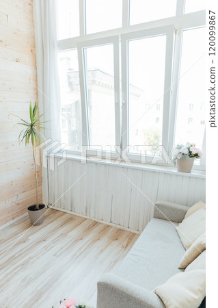 Interior of an empty white room with a window 120099867