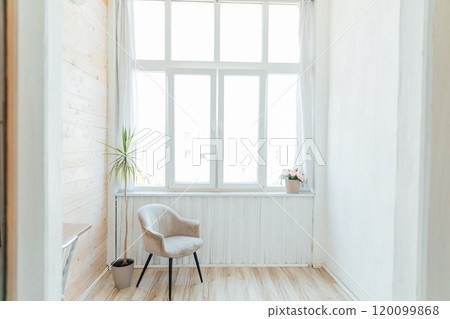 Interior of an empty white room with a window 120099868