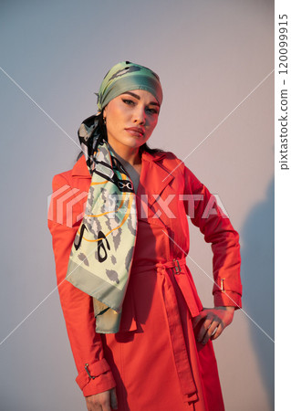 Portrait of a beautiful fashionable woman in a red autumn dress Portrait of a beautiful fashionable woman in a red autumn dress 120099915