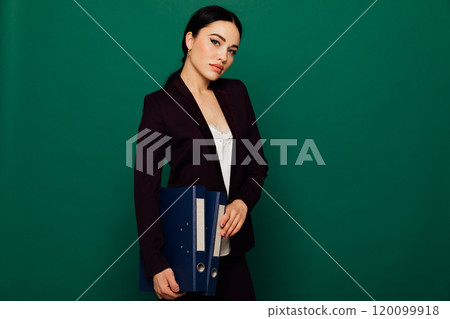Portrait of a beautiful fashionable woman in a business suit in an office Portrait of a beautiful fashionable woman in a business suit in an office 120099918