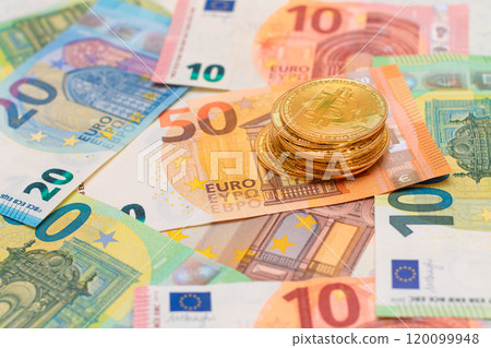 A Stack of Bitcoin Coins on the Euro Banknotes A Stack of Bitcoin Coins on the Euro Banknotes 120099948