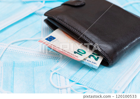 Black Men's Wallet with Euro Money Inside on the Blue Disposable Medical Face Masks 120100533