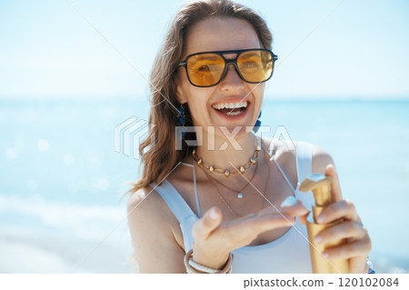 happy elegant 40 years old woman on seacoast with spf happy elegant 40 years old woman on seacoast with spf 120102084