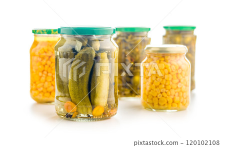 Pickles. Marinated cucumbers in jar isolated on white background. 120102108