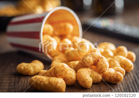 Puffed crispy Peanut flips on wooden table. 120102120