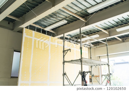 Walls and scaffolding at a construction site Walls and scaffolding at a construction site 120102650