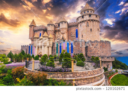 Fantastic medieval castle at Ba Na Hills Amusement Park in Da Nang Vietnam at sunset 120102671