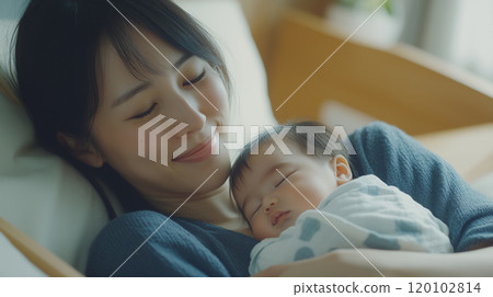 A parenting shot of a smiling mother holding a baby A parenting shot of a smiling mother holding a baby 120102814