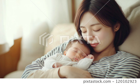 Baby and mom taking a nap together 120102923