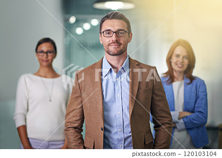 Success is a state of mind. Portrait of a business with his colleagues blurred in the background. Success is a state of mind. Portrait of a business with his colleagues blurred in the background. 120103104