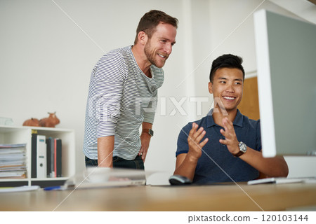 Business discussions. Cropped shot of two designers working together on a project in an office. Business discussions. Cropped shot of two designers working together on a project in an office. 120103144