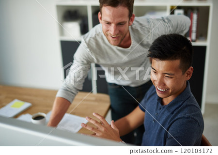 Young visionaries in design. High angle shot of two designers working together on a project in an office. 120103172