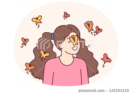 Little girl among butterflies flying and landing on face for spring mood concept 120103220