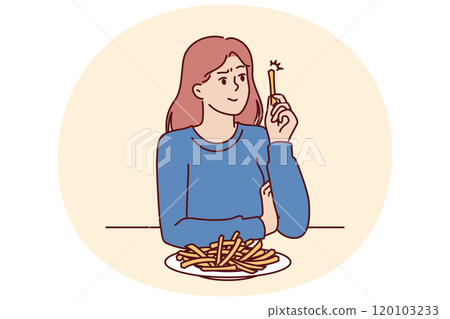 Woman eats french fries without thinking about health risks of fast food and fried snacks 120103233