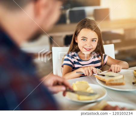 Thanks for breakfast, dad. Cropped shot of an adorable little girl having breakfast with her father in the kitchen. 120103234